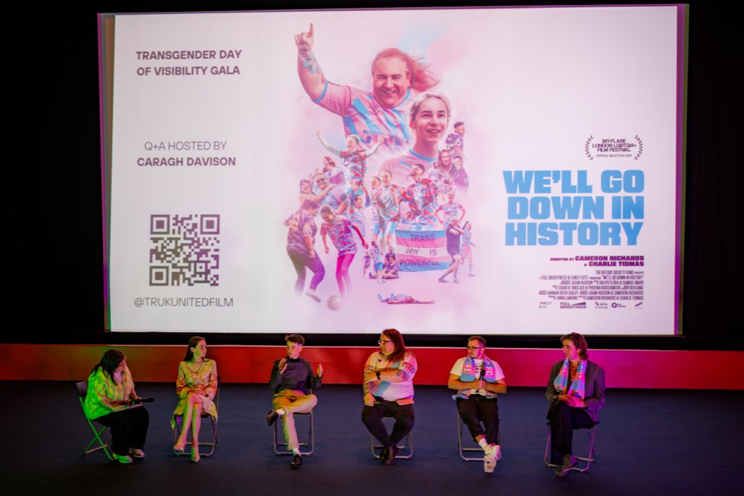 Q&A panel seated beneath the film's title on a cinema screen