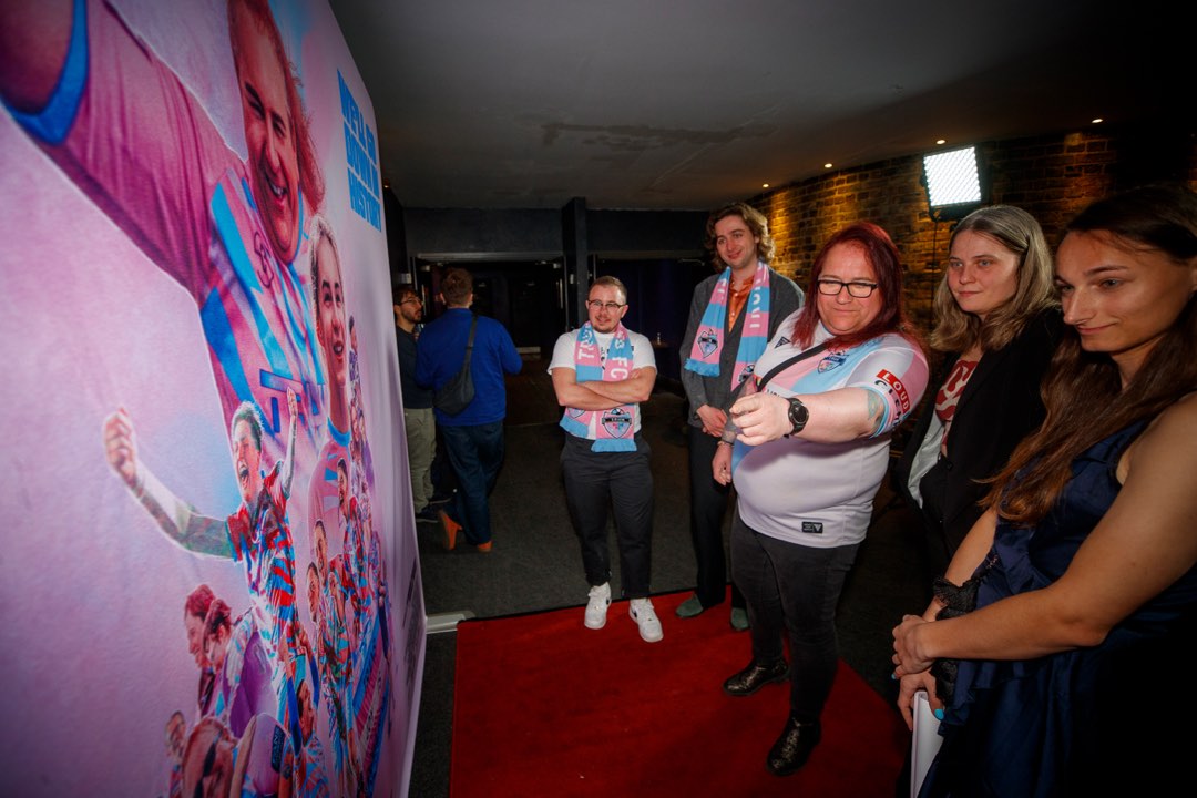 Guests talking at a red-carpet gala screening