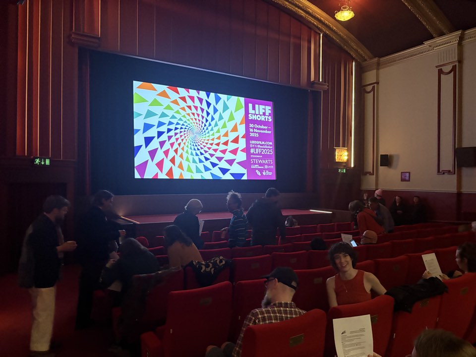 Cinema auditorium with a film on screen