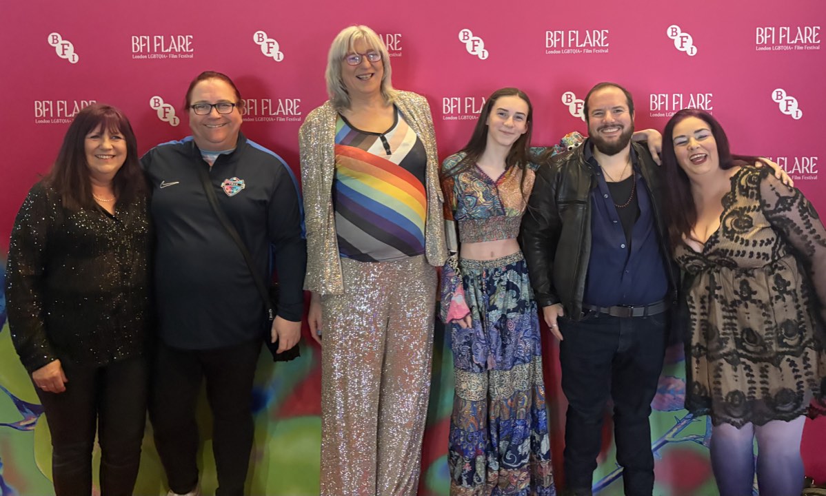 Group at a festival photo wall