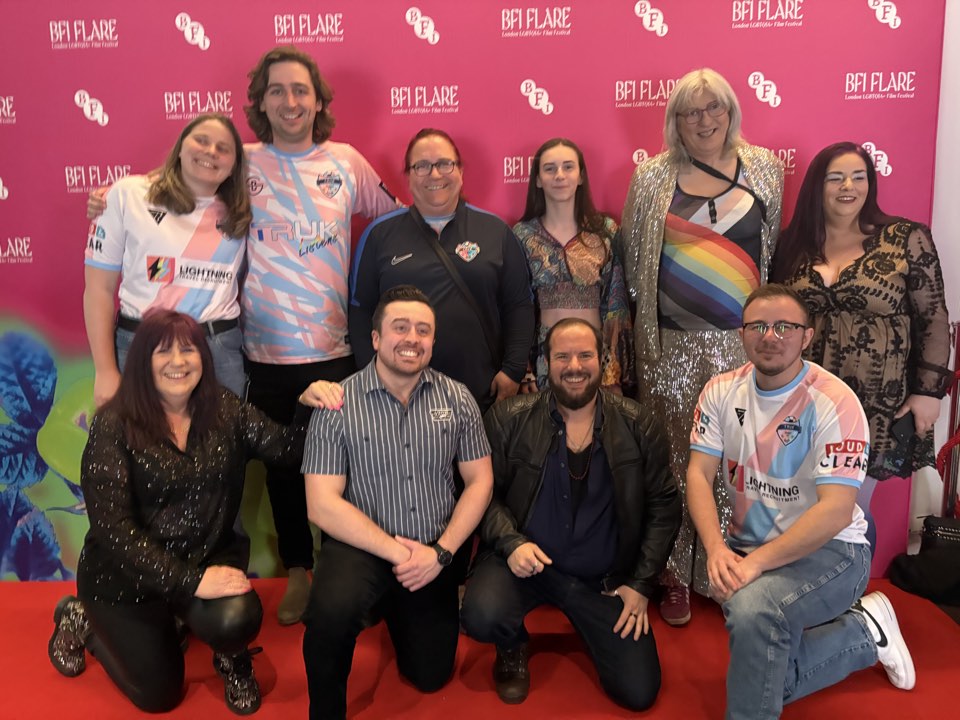 Large group at a festival photo wall