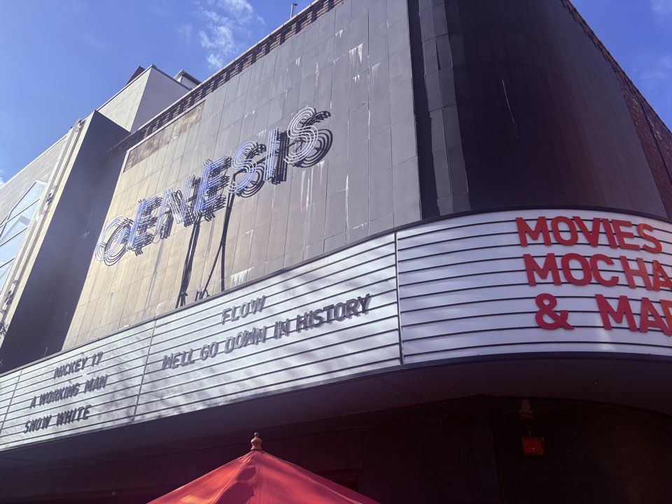 Cinema exterior with the film's title on the marquee