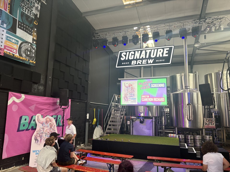 Stage and screen at an indoor venue