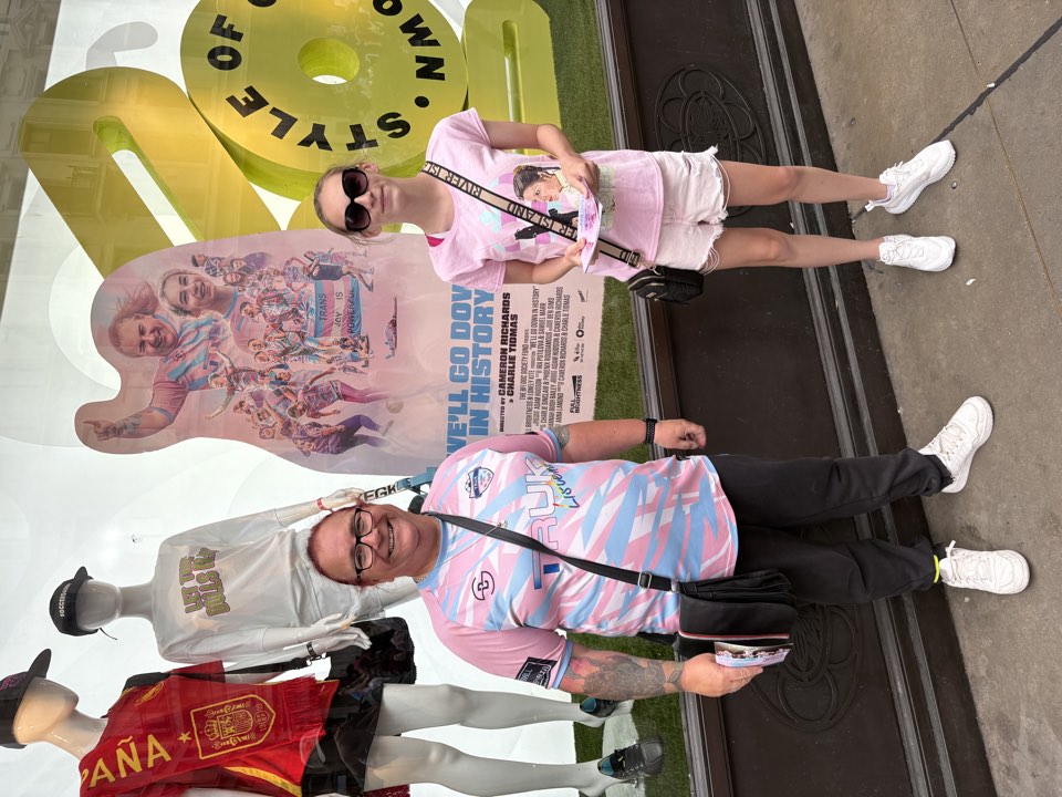 Two people outside a venue